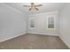 Bright bedroom with two windows and a ceiling fan with light at 613 Tuscany Cir, Princeton, NC 27569