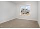 Bedroom featuring a window with a view of a house and a car at 613 Tuscany Cir, Princeton, NC 27569