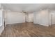 Spacious living room boasts wood-look flooring, neutral walls, and ample space for entertaining at 613 Tuscany Cir, Princeton, NC 27569