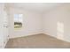 Bedroom with neutral carpet, and a single window offering natural light at 65 Barony Ln, Smithfield, NC 27577