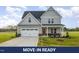 Charming two-story home with a two-car garage, complemented by a well-manicured lawn at 65 Barony Ln, Smithfield, NC 27577
