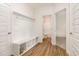 A well-lit mudroom with hall tree, wood-look floors, and storage at 65 Barony Ln, Smithfield, NC 27577