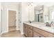 Double sink vanity with granite countertop in bathroom with tile flooring and a glass-enclosed shower at 68 Tee Dr, Selma, NC 27576