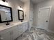 Bathroom featuring double sink vanity with granite counters and herringbone tile floors at 702 Tuscany Cir, Princeton, NC 27569