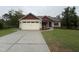 Charming single-story home featuring a spacious driveway, attached garage, and well-maintained lawn at 702 Tuscany Cir, Princeton, NC 27569