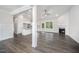 Bright living space with open concept, fireplace and sleek dark hardwood flooring at 702 Tuscany Cir, Princeton, NC 27569