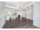 Open concept living space combining the kitchen, living room, and dining area at 702 Tuscany Cir, Princeton, NC 27569