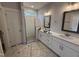 Bathroom with double vanity, walk-in shower, and modern fixtures at 71 Royal Ave, Selma, NC 27576