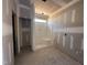 Modern bathroom showcasing a new shower and a window for natural light, awaiting final touches at 71 Royal Ave, Selma, NC 27576