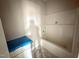 Full bathroom features tile flooring and tub at 71 Royal Ave, Selma, NC 27576