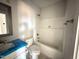 The bathroom showcases a shower-tub combination and modern vanity, offering comfort and style at 71 Royal Ave, Selma, NC 27576