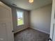 Well lit bedroom with neutral paint and plush carpet, providing a calming and comfortable space at 71 Royal Ave, Selma, NC 27576