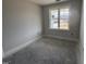 This bedroom has natural light from a window that looks out onto the surrounding neighborhood at 71 Royal Ave, Selma, NC 27576