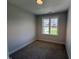Well lit bedroom with neutral paint and plush carpet, providing a calming and comfortable space at 71 Royal Ave, Selma, NC 27576