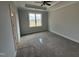Bedroom with neutral carpet, natural light, and a ceiling fan for comfort at 71 Royal Ave, Selma, NC 27576