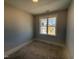 Bright bedroom with a large window offering natural light and neighborhood views at 71 Royal Ave, Selma, NC 27576