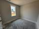 Bright bedroom with large window allowing natural light, awaiting personalized finishing touches and flooring at 71 Royal Ave, Selma, NC 27576
