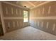 Unfinished bedroom with a bright window, awaiting your personal design and finishing touches at 71 Royal Ave, Selma, NC 27576
