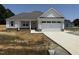 New construction boasts a two-car garage, stone accents and a covered porch, inviting you to call it home at 71 Royal Ave, Selma, NC 27576