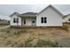 The exterior of a one-story home with white siding and a covered porch is shown at 71 Royal Ave, Selma, NC 27576