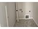 Laundry room with tile flooring and hookups ready for washer and dryer at 71 Royal Ave, Selma, NC 27576