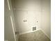 A spacious laundry room provides ample space for cleaning and storage, enhancing convenience at 71 Royal Ave, Selma, NC 27576