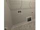 Well lit laundry room with overhead storage rack and connections for washer and dryer at 71 Royal Ave, Selma, NC 27576