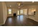 Open-concept living room features a fireplace, ceiling fan and beautiful views of the backyard at 71 Royal Ave, Selma, NC 27576