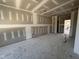 Spacious living room featuring freshly installed drywall, awaiting your personal design touches at 71 Royal Ave, Selma, NC 27576