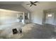 Spacious open-concept boasts a ceiling fan, and views of the kitchen and dining area at 71 Royal Ave, Selma, NC 27576