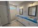 Main bathroom featuring dual sinks, and a modern tiled shower at 71 Royal Ave, Selma, NC 27576
