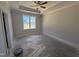 Spacious main bedroom with a tray ceiling and a ceiling fan at 71 Royal Ave, Selma, NC 27576