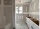Bathroom featuring a tub/shower and cabinets with drawers for storage at 76 Royal Ave, Selma, NC 27576