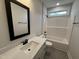 Bathroom with white vanity, quartz countertop, shower and tub combination at 76 Royal Ave, Selma, NC 27576
