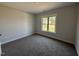 Empty bedroom featuring neutral walls, carpet and one window at 76 Royal Ave, Selma, NC 27576