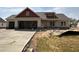 Charming new construction home with a three-car garage and red accent trim at 76 Royal Ave, Selma, NC 27576