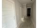 Entryway featuring white wainscotting, a built-in bench, and trim work at 76 Royal Ave, Selma, NC 27576