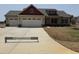Charming two-story home featuring a three-car garage and a well-manicured lawn at 76 Royal Ave, Selma, NC 27576