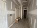 Hallway with a bench and shelving storage area by the front door at 76 Royal Ave, Selma, NC 27576
