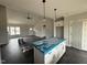 Spacious kitchen with island, pendant lighting, and modern appliances at 76 Royal Ave, Selma, NC 27576