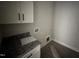 Laundry room featuring granite counter and cabinets at 76 Royal Ave, Selma, NC 27576