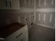 Laundry room area showing hookups, electrical outlets, and cabinetry at 76 Royal Ave, Selma, NC 27576
