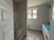 Main bathroom with new shower at 76 Royal Ave, Selma, NC 27576