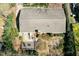Aerial view of home with patio, deck, landscaping and mature trees at 7605 Mine Valley Rd, Raleigh, NC 27615