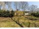 Home with a wooded backyard and mature trees and foliage at 7605 Mine Valley Rd, Raleigh, NC 27615