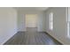 Living room features gray flooring, natural light, white trim, and neutral paint at 7605 Mine Valley Rd, Raleigh, NC 27615
