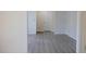 The living room offers neutral walls, white trim, and durable gray flooring at 7605 Mine Valley Rd, Raleigh, NC 27615