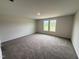 Bedroom with carpet flooring and natural light at 8 W Emily Gardens Dr, Selma, NC 27576