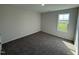 Comfortable bedroom featuring carpet floors and a large window with nice view at 8 W Emily Gardens Dr, Selma, NC 27576