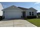 Charming single-story home with a two-car garage and well-manicured lawn at 8 W Emily Gardens Dr, Selma, NC 27576